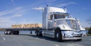 image of a Flatbed Trucking Trailer. Flat Bed Trailer hauling lumber