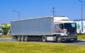 trucking companies carrying goods and moving towards port for shipment