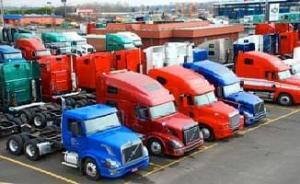 California trucking companies on the road with various types of trucking equipment, colors, and trailers