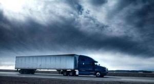An image displaying a full truckload on the road with beautiful background