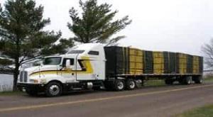Loaded flatbed Montana Trucking on its way for delivery