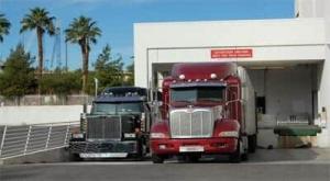 Miami, Fl to Dallas, Tx Freight Trucking Company standing at the warehouse to get loaded in Laredo, Tx